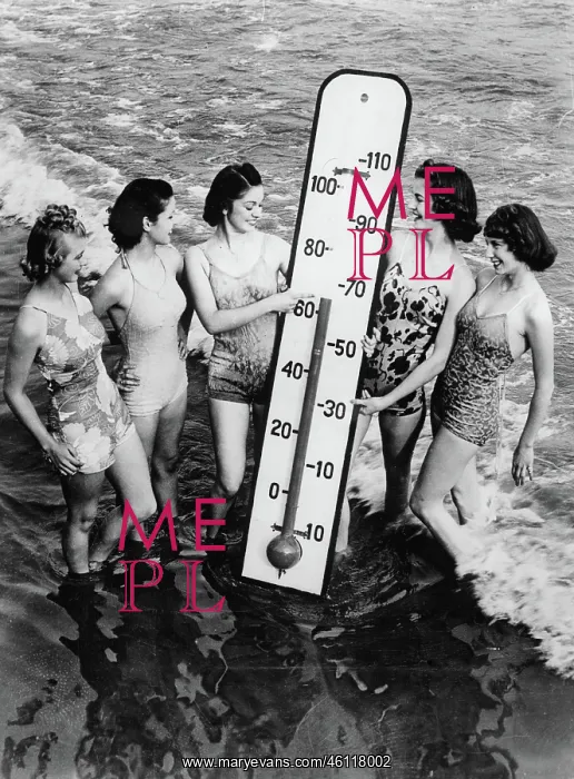 : Women on the beach with an oversized : Women on the beach with an oversized