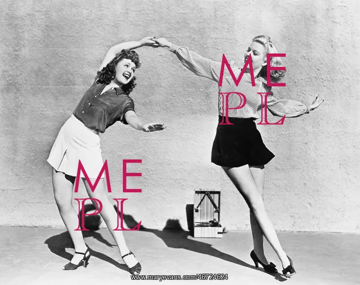: Two women dancing outside : Two women dancing outside