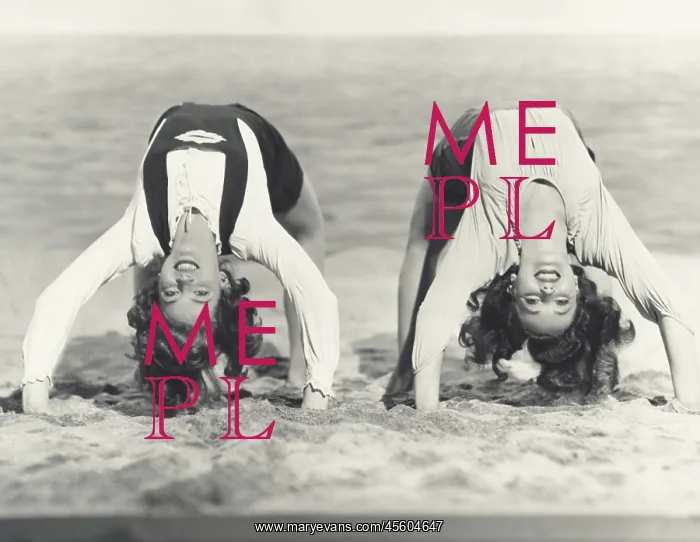 : Two women doing backbends on the beach : Two women doing backbends on the beach