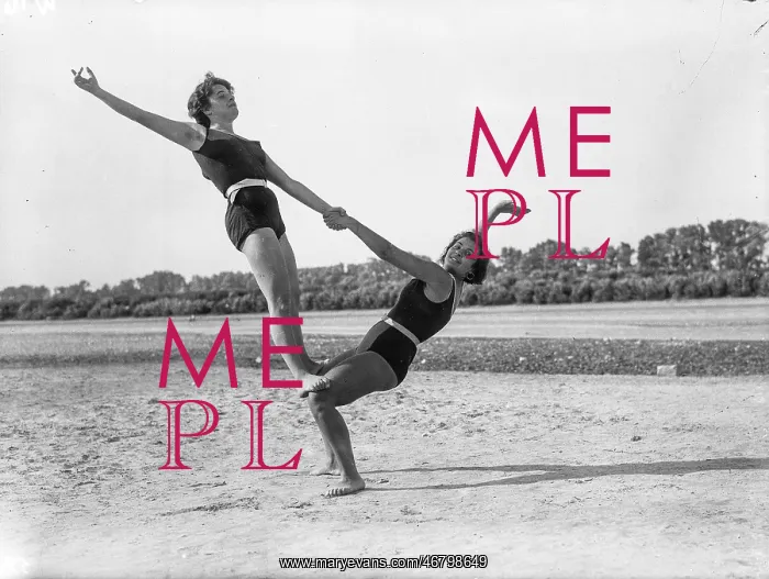 : Two women doing gymnastics : Two women doing gymnastics