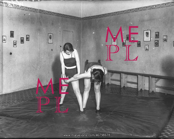  : Women doing judo in a gym