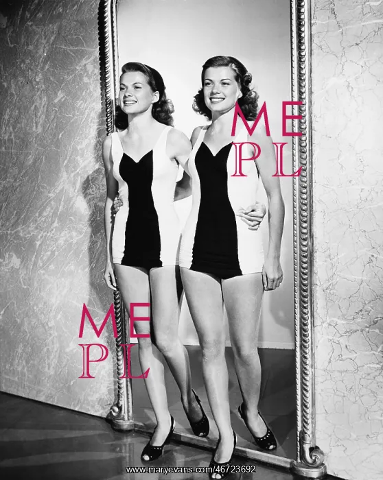 : Two women entering in a room and smiling : Two women entering in a room and smiling