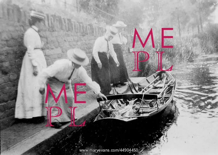 : Women getting onto rowing boat : Women getting onto rowing boat