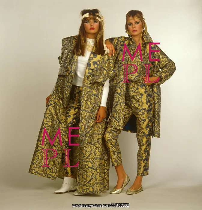  : Two women in gold patterned outfits
