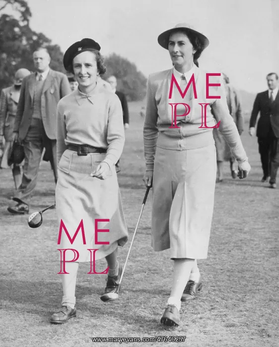 : Two women golfers on a golf course : Two women golfers on a golf course