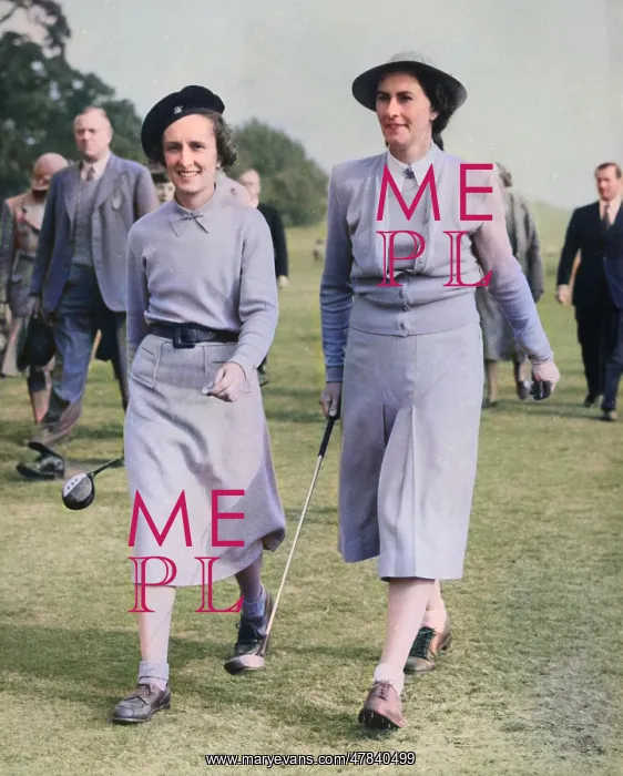 : Two women golfers on a golf course : Two women golfers on a golf course