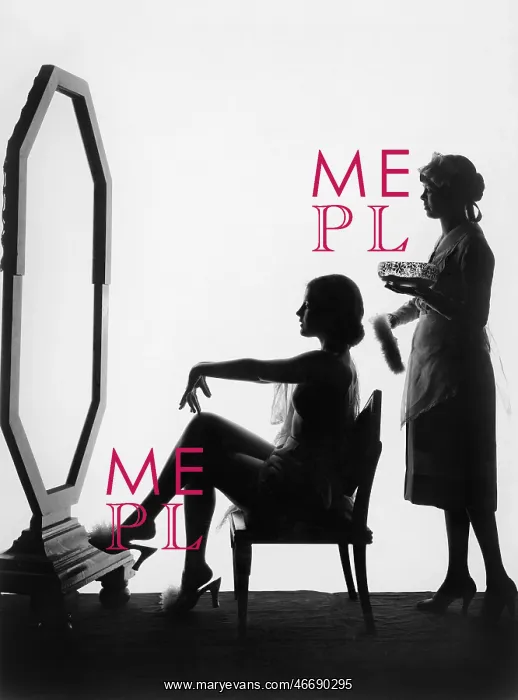 : Two women in front of a large mirror : Two women in front of a large mirror