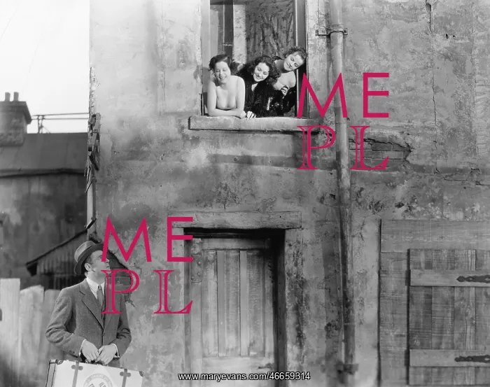 : Three women looking out of a window at a man standing : Three women looking out of a window at a man standing