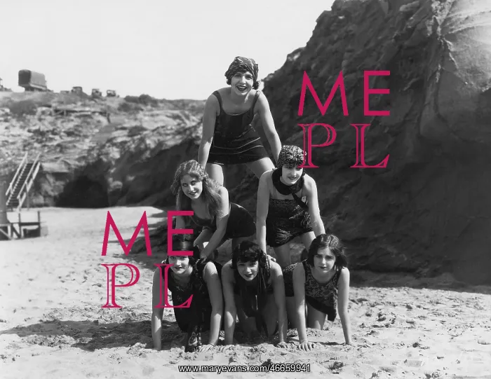 : Women making a pyramid on the beach : Women making a pyramid on the beach