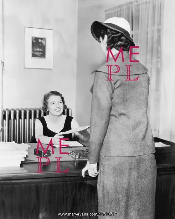: Two women at an office : Two women at an office