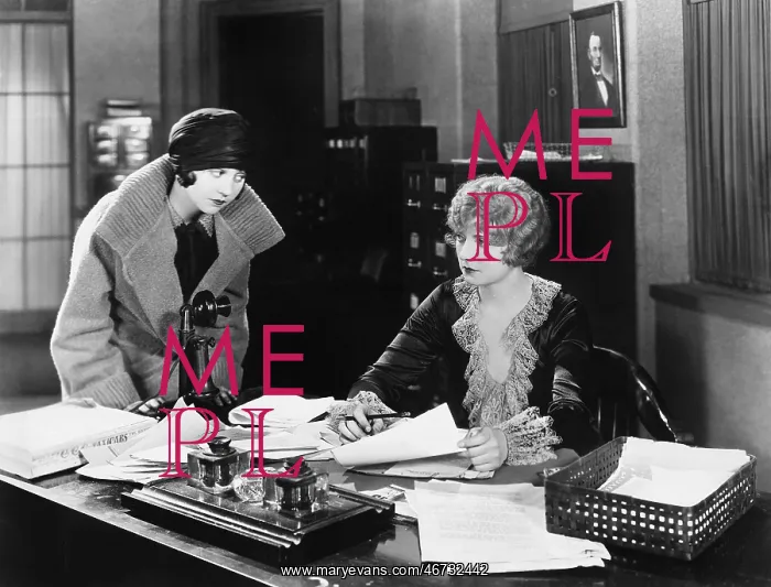 : Two women in an office : Two women in an office