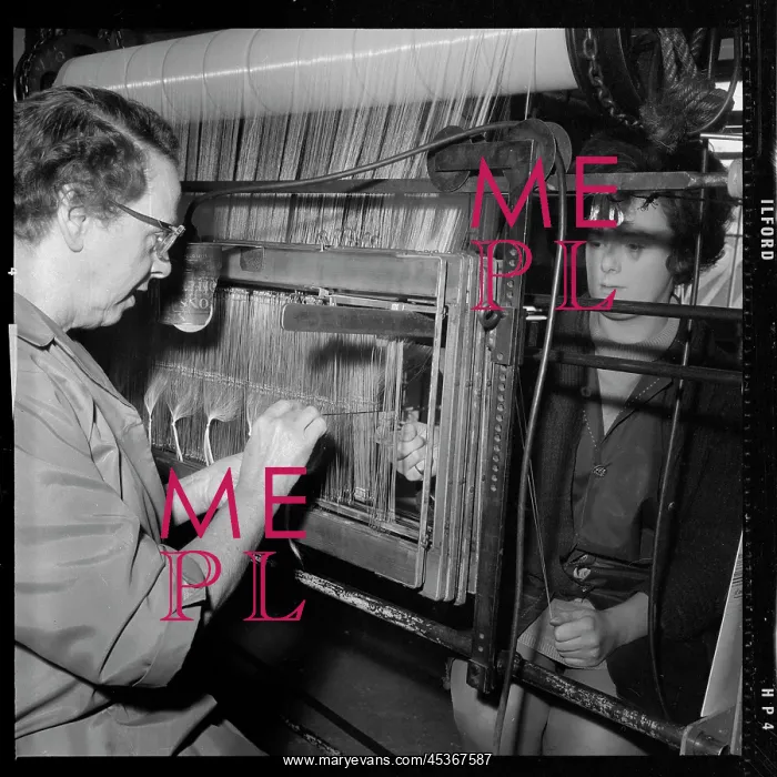 : Two women passing warp threads through healds (heddles) : Two women passing warp threads through healds (heddles)