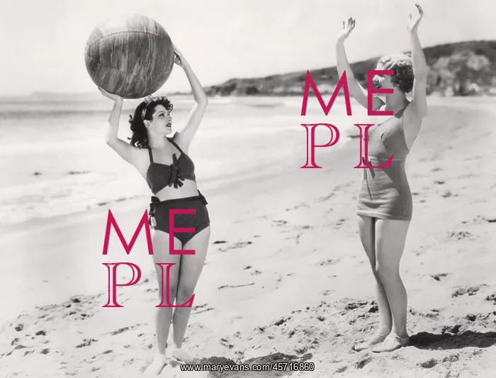  : Two women playing ball on the beach