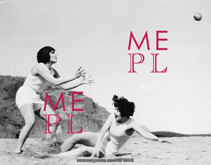 : Two women playing with a ball at the beach : Two women playing with a ball at the beach