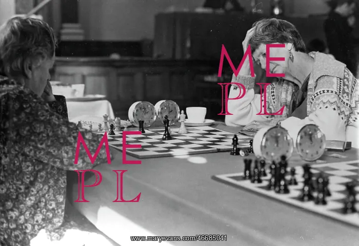  : Women playing chess in a tournament