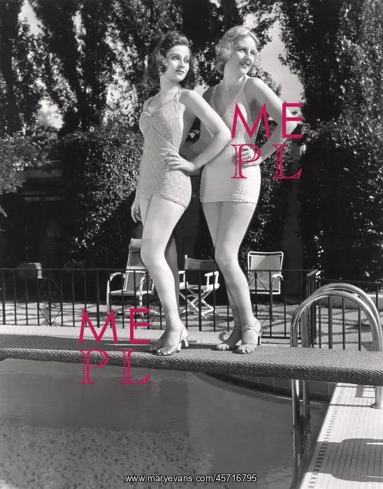  : Two women posing on a diving board