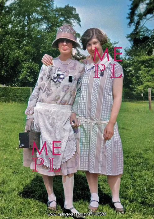 : Two women posing in a field : Two women posing in a field