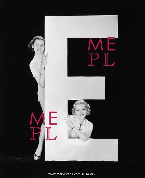  : Women posing with huge letter E