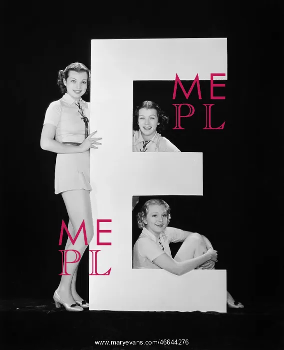 : Women posing with huge letter E : Women posing with huge letter E