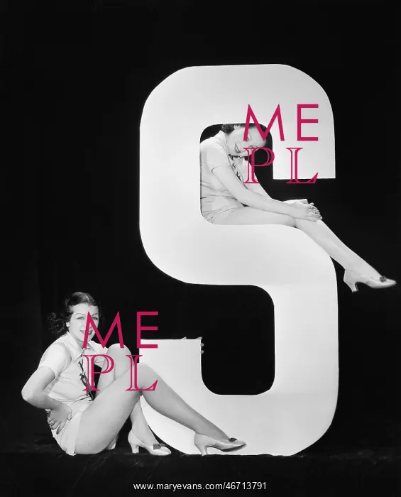  : Women posing with huge letter S
