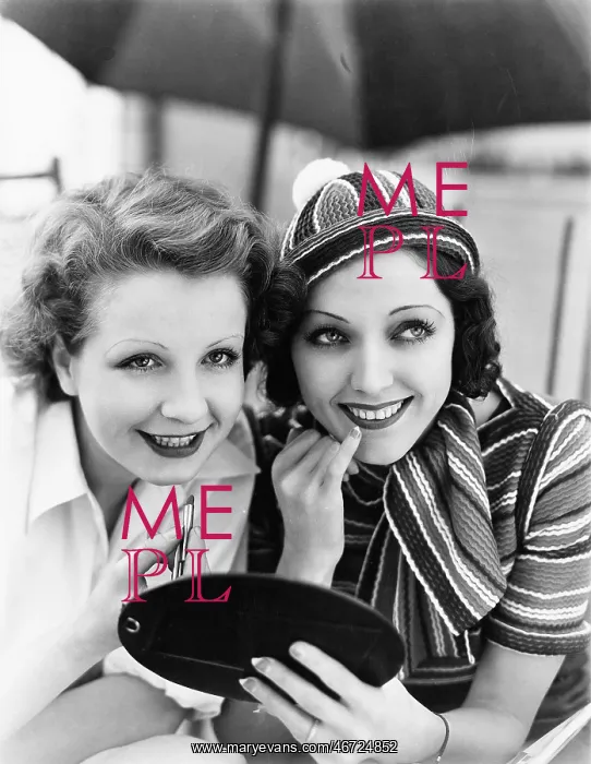 : Two women putting on makeup : Two women putting on makeup
