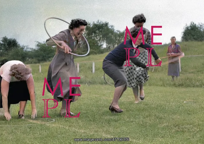 : Women running a race with hoops : Women running a race with hoops