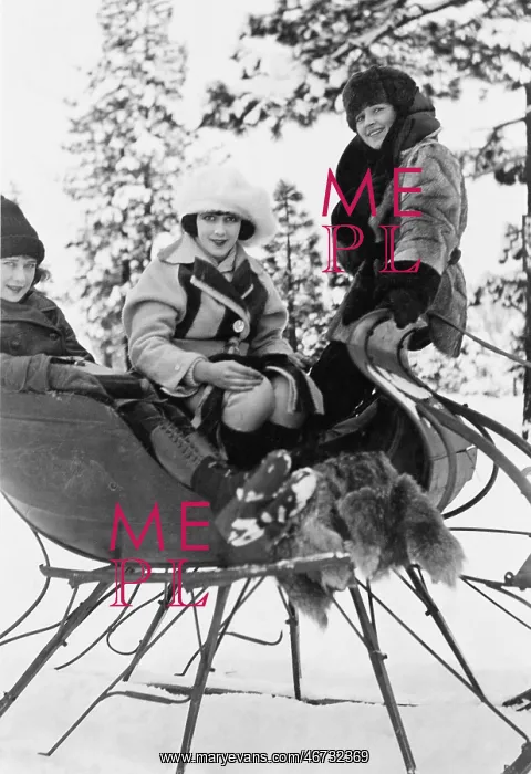  : Three women sitting in a sled