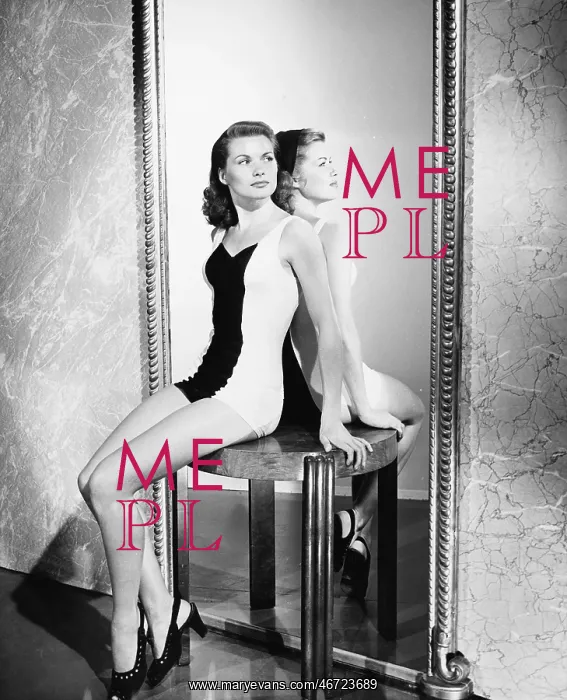 : Two women sitting back to back on a table : Two women sitting back to back on a table