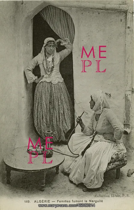 : Two women smoke from a hookah pipe, Algeria : Two women smoke from a hookah pipe, Algeria
