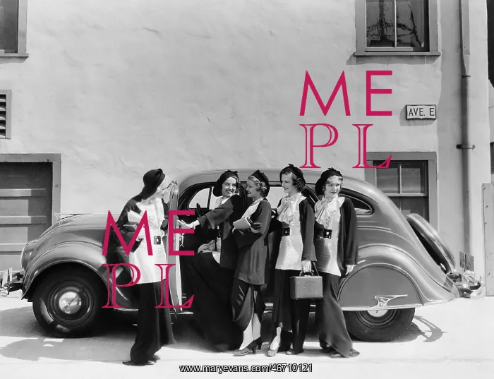 : Five women standing in front of a car : Five women standing in front of a car