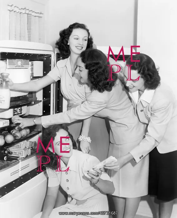 : Four women taking things from a refrigerator : Four women taking things from a refrigerator