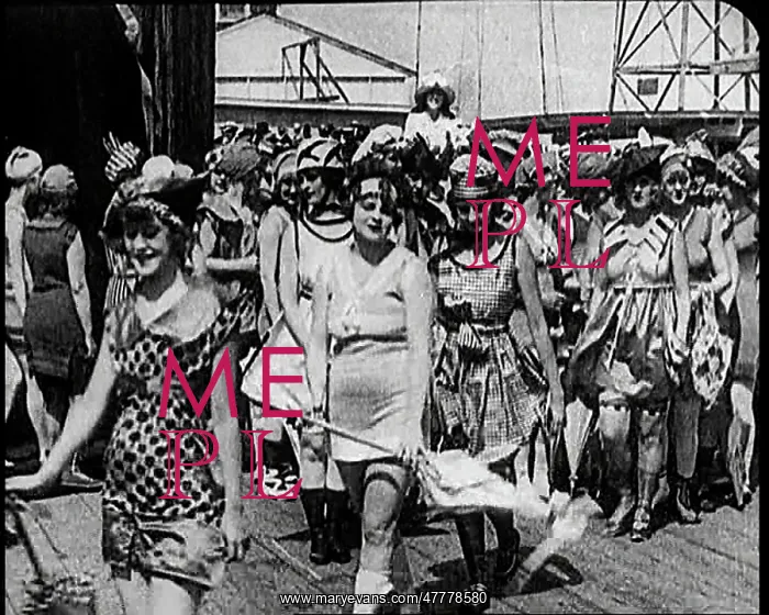 : Women Walking By In Bathing Suits on a Beachfront : Women Walking By In Bathing Suits on a Beachfront