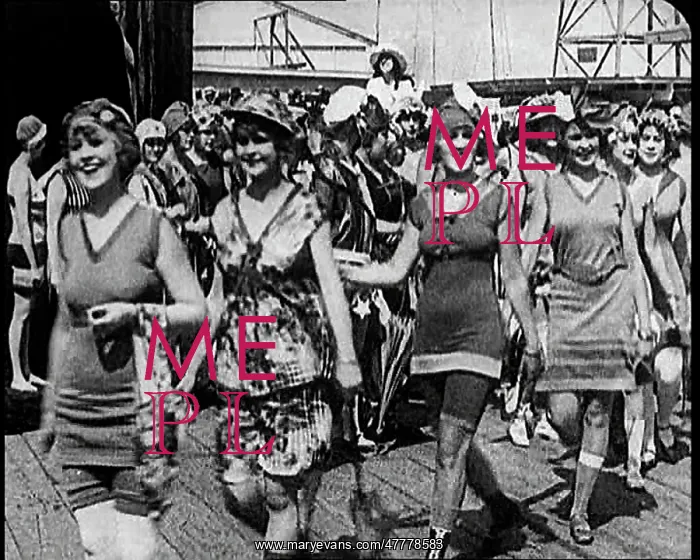 : Women Walking By In Bathing Suits on a Beachfront : Women Walking By In Bathing Suits on a Beachfront