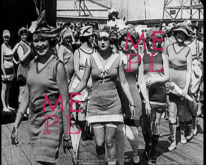 : Women Walking By In Bathing Suits on a Beachfront : Women Walking By In Bathing Suits on a Beachfront