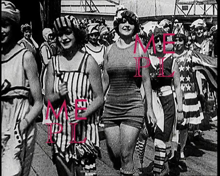 : Women Walking By In Bathing Suits on a Beachfront : Women Walking By In Bathing Suits on a Beachfront