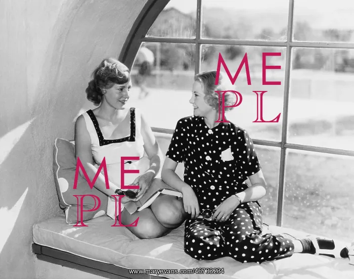 : Two women in front of a window looking at each other : Two women in front of a window looking at each other