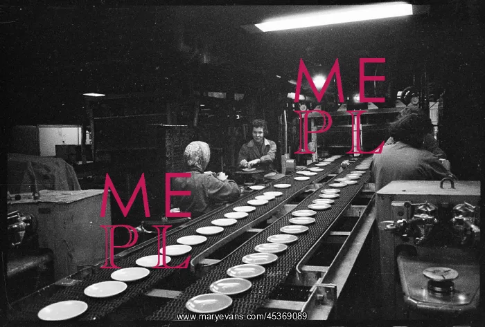 : Women working beside a conveyor belt carrying