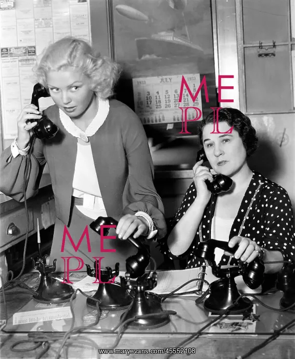 : Two women working on a phone bank : Two women working on a phone bank
