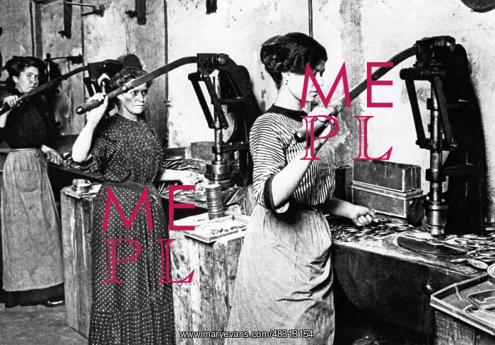 : Women working at a punching machine, 1911 : Women working at a punching machine, 1911