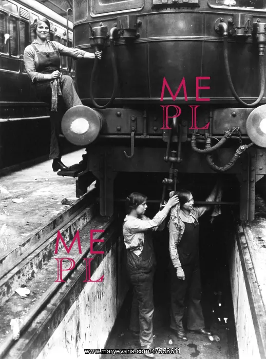 : Three women working on a train carriage : Three women working on a train carriage
