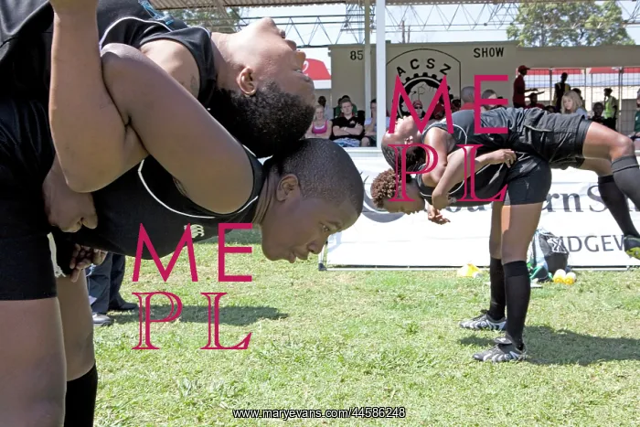 : A women's 7's rugby team warming up during an : A women's 7's rugby team warming up during an