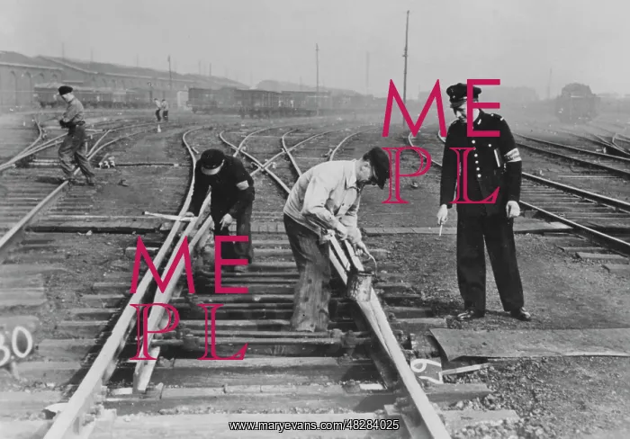 : Worker doing track work in France, 1940 : Worker doing track work in France, 1940