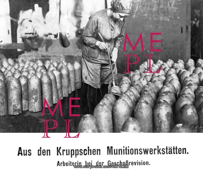 : Worker inspecting bullets, 1916 : Worker inspecting bullets, 1916