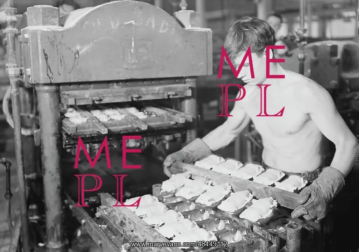 : Worker pressing rubber bodies for doll characters, 1936 : Worker pressing rubber bodies for doll characters, 1936
