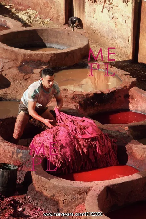 : Fez. Detail of worker in vat, Chouara tannery : Fez. Detail of worker in vat, Chouara tannery