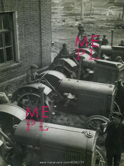 : Workers on American made McCormick Deering tractors : Workers on American made McCormick Deering tractors