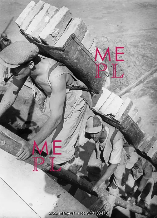 : Workers carry bricks, 1939 : Workers carry bricks, 1939