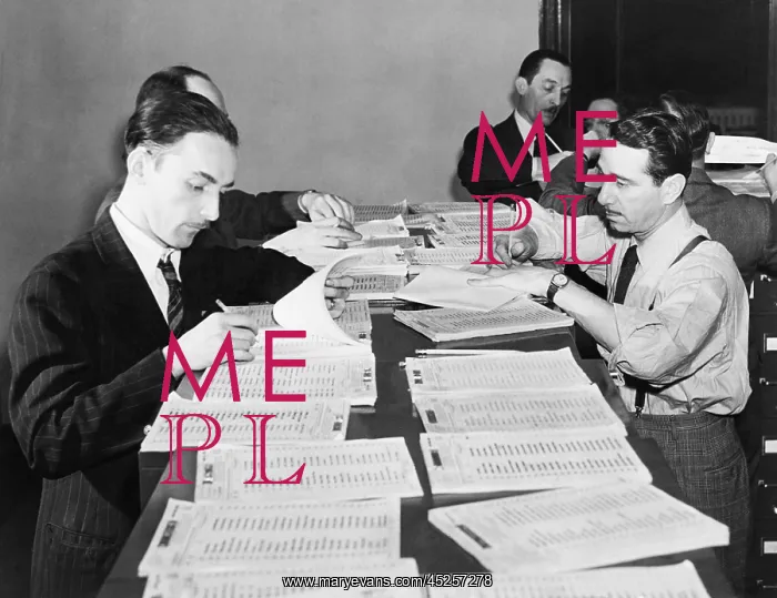 : Workers checking names and numbers at New York : Workers checking names and numbers at New York