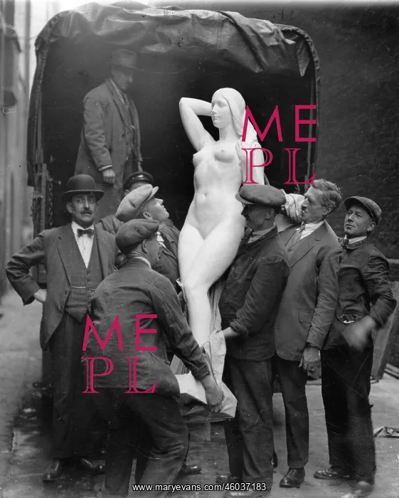 : Workers lifting a sculpture of a woman from a lorry : Workers lifting a sculpture of a woman from a lorry