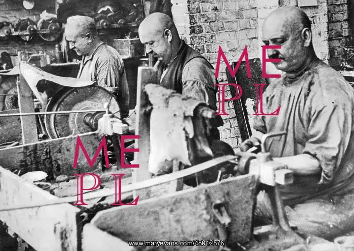 : Three workers on machines, approx. 1930 : Three workers on machines, approx. 1930